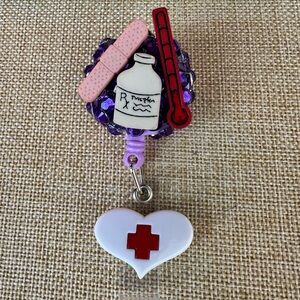Purple Medical-Themed Retractable Badge Reel with White Heart and Red Cross